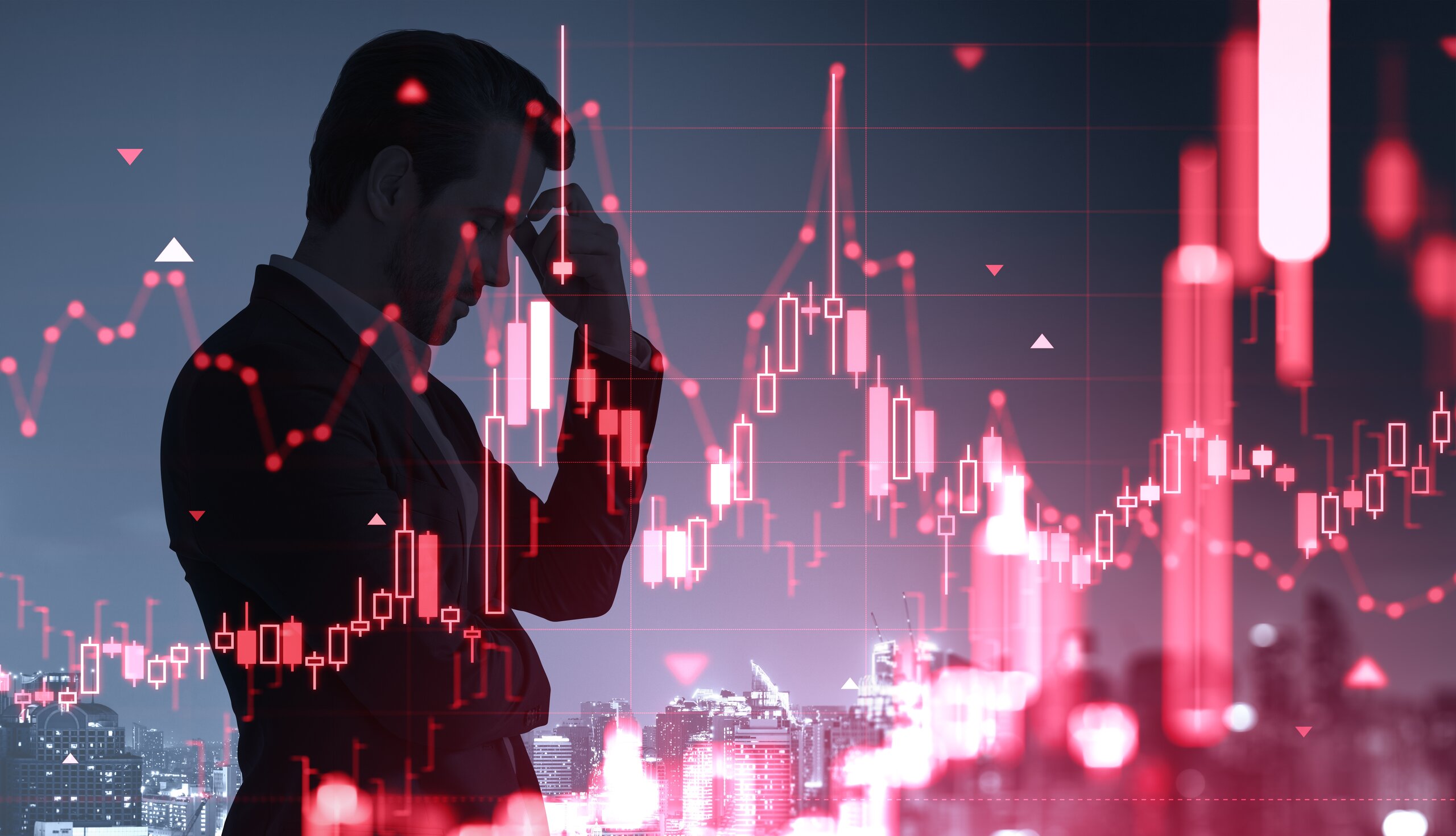 A concerned investor considers what investors can do next while reviewing falling financial charts.